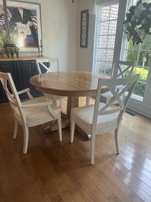 Mr. Munden turned our old Ethan Allen cherry table and chairs into a beautiful up-to-date dining set.  Love it!