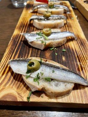 Vinegar soaked anchovies on bread