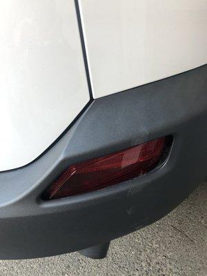 Damaged photo: bumper and pushed in tail light!