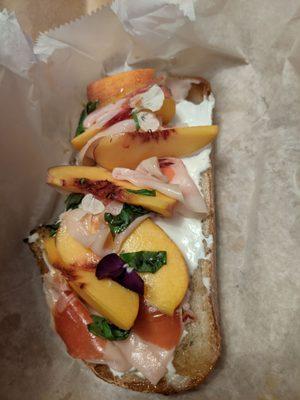 Open faced Peach and Prosciutto with basil and whipped ricotta, super delicate.  Wrapped up very nice and got home safe.