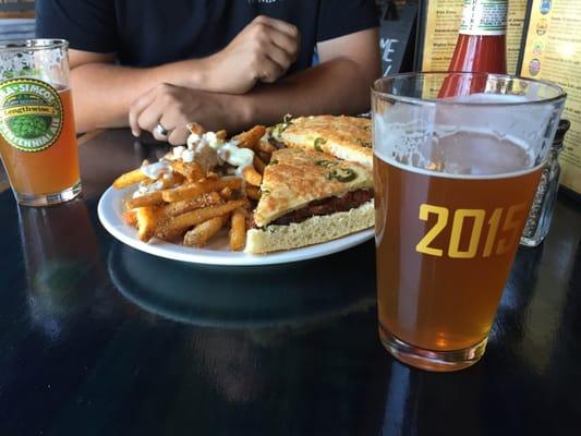 Tri-tip sandwich with stanky fries with a centennial