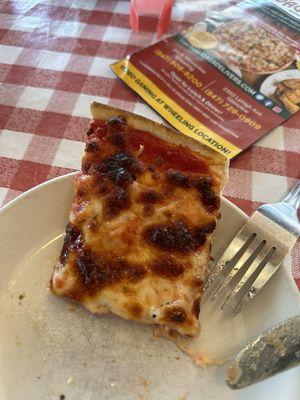 A slice of cheese and onion Famous Thin Crust Pizza