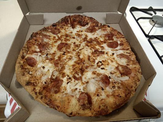 Large 6 cheese Wisconsin pizza with onions and pepperoni.