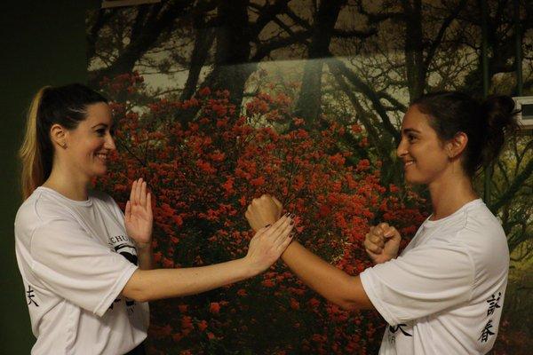 Female Wing Chun practioners playing kung fu and having fun.