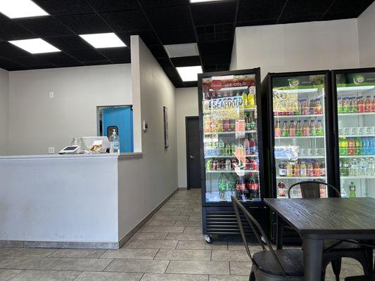 Front counter and fridge with drinks