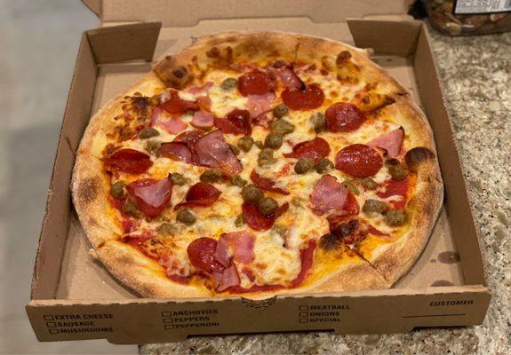 Small Meat Lovers pizza! Dough is hand tossed! Why haven't I had the pizza here before? If you love thin crust, give them a try!