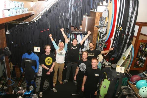 Winning Best Surf Shop year after year. The crew getting pictured for the award in front of the 500 wetsuit rack