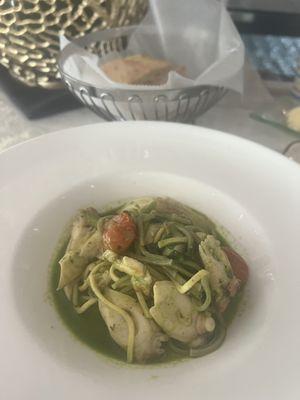 Pasta with pesto seafood sauce . Out of this world!!