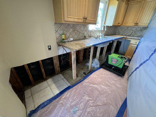 Cabinets are gone, the wall is open and the granite counter is still in one piece. The dehumidifier was in place for about 8 days.