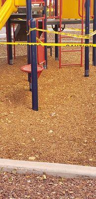 Liquor bottles in the play area at Encantada Apartments.