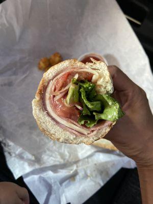 Smart way of centering the meat in the fold of the bread so nothing falls out