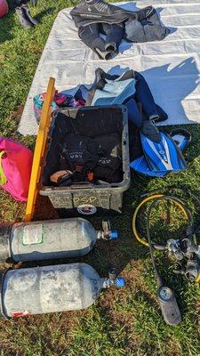 Photo from the first ocean day of my gear near our tarp; includes rental gear and tanks from shop, as well as personal gear I had to buy.