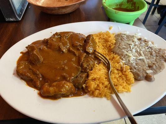 Chile Colorado, tender pieces of pork in a tasty red sauce.