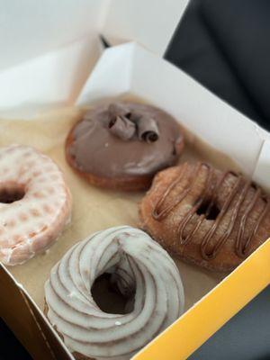 Original glazed, Boston Kreme, French cruller, churro de leche