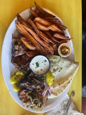 Lamb kabobs with side of sweet potato fries