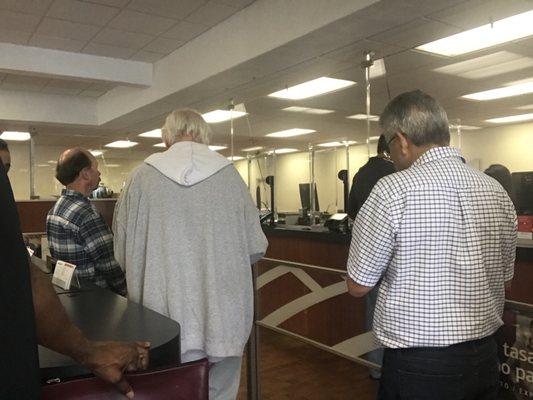 Couldn't capture the angle but 15 people. One teller at lunchtime.