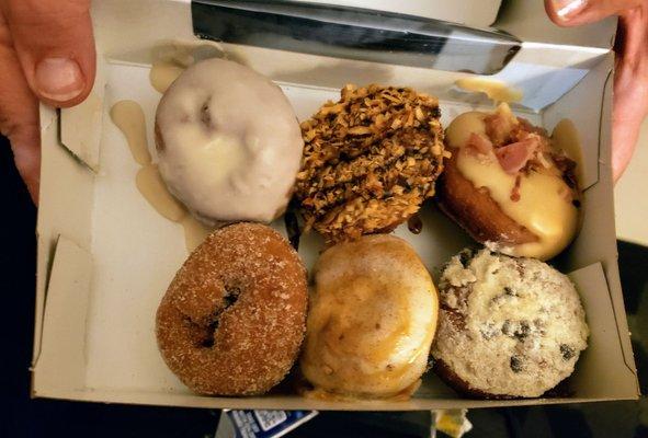 From Peace, Love and Little Donuts...I had the Banana Chocolate Chip (Lower Right), which was great! The Bacon Maple looked good also...