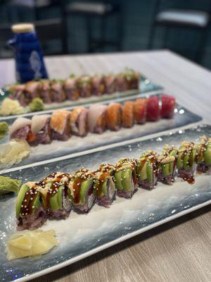 Front to back: Snow Flower Roll, Over The Rainbow Roll, Yellowtail Lover Roll