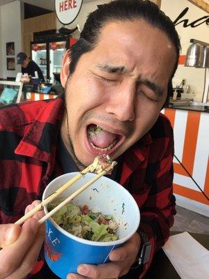 The hubs with his: Sushi rice and salad base Spicy mayo sauce Ahi tuna Green onions, cucumber, avocado, edamame, and nori