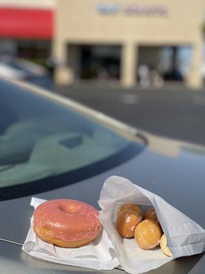 Morning sweets! Glazed mini donuts $1 for eight & &1.10 for the big glazed strawberry flavor donut