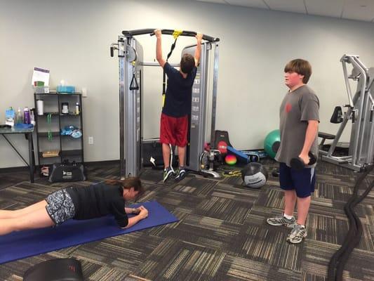 Family workout mother and her two twins