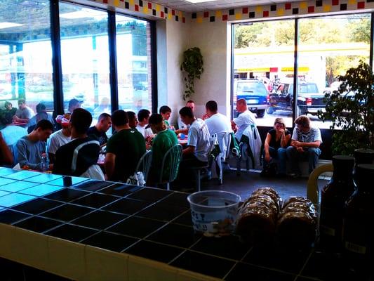 Billerica football team enjoying a meal together!