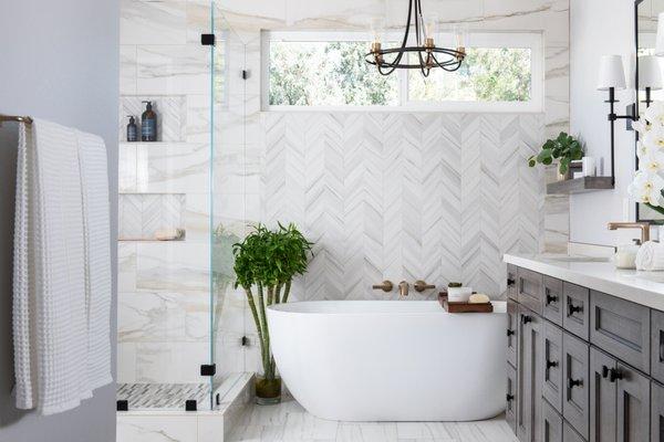 Primary bathroom remodel with gorgeous chevron pattern accent wall and brand new semi-custom vanity