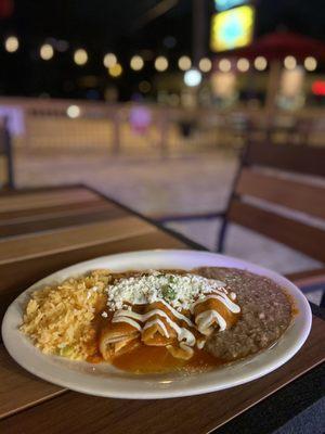 Chicken Enchiladas Rojas with rice and beans