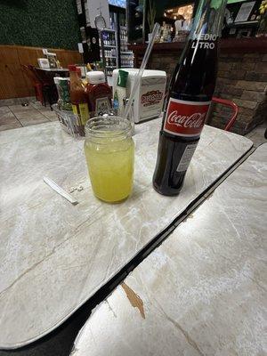 Nice Little glass of pineapple juice and a Mexican coke