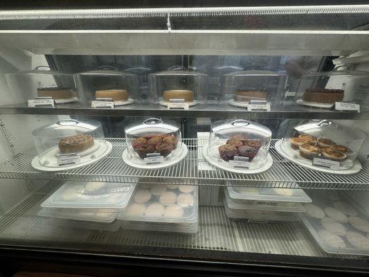 Front case of baked goods. The cheesecakes do look heavenly