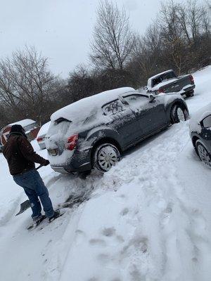 My 63 year old father helping me shovel my car out... pretty sure that's not in the lease as "tenants responsibility" !