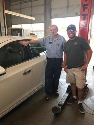 My boyfriend and Fred next to our newly repaired window!