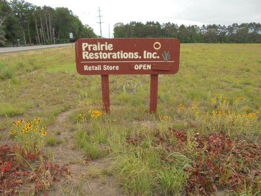 Main sign at the driveway entrance on 128th.