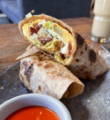 "The Six" Breakfast Chapati - organic eggs, applewood smoked bacon, potato, cheddar, breakfast sausage, maple butter, scallion