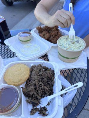 Brisket, potato salad, fried chicken and cornbread muffin