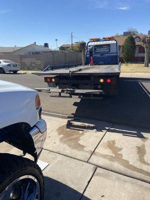 Tow truck picking up my Yukon to deliver it to Aamco for warranty work which was not honored