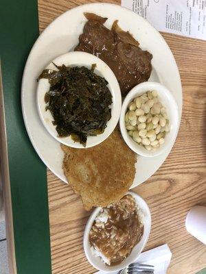 Chopped streak with onions and gravy, rice and gravy, collards, butter beans, and corn bread.