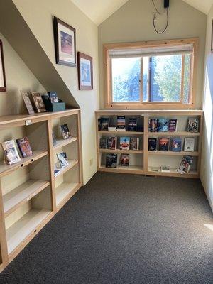 Upstairs book corner. Cozy, yet spacious. Local authors book display? Say LESS!