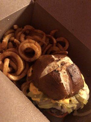 Philly cheese burger with pretzel bun