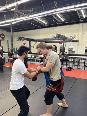 My son working on the Fighting Sarong with a classmate.