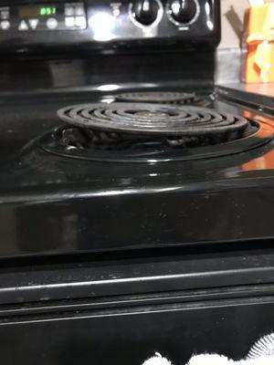 Stove top that couldn't be used because it was so slanted and wouldn't hold a pan.