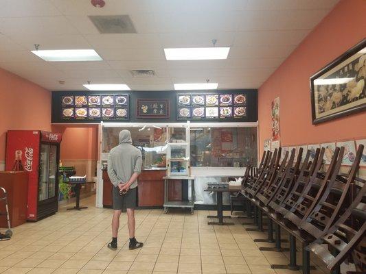 Inside of restaurant during COVID19 indoor dining shutdowns. Taken to show the COVID19 precautions with the plexi-glass.