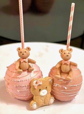 From the dessert shop: Chocolate covered candy apples adorned with fondant teddy bears. Also, shown with teddy bear decorated cookie