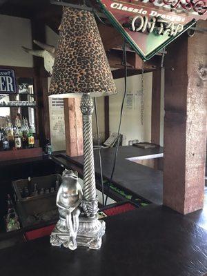 Weird frog lady lamp at bar