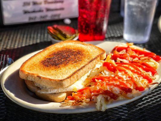 Bacon Egg & Cheese Sandwich, with hash browns ($7.50). Served street side and employee was wearing a mask.