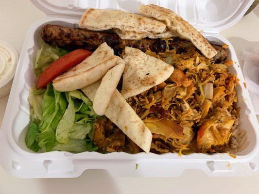 Chicken and kofta over rice with salad and pita bread pieces