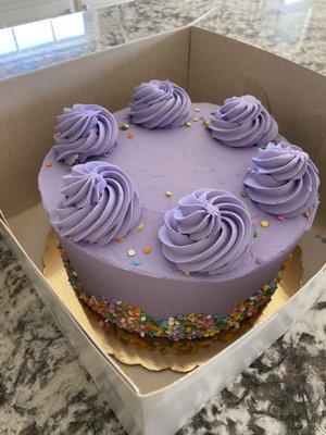 Chocolate cake with chocolate mousse filling, buttercream vanilla purple frosting.