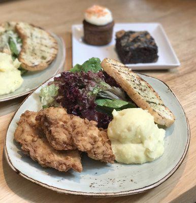 Fried chicken plate with mashed potatoes and baby greens