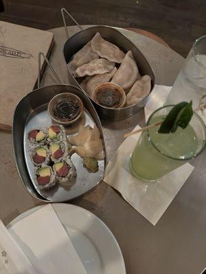 Salmon roll, chicken dumplings, and gin based drink.