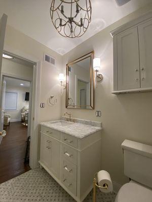 The bathroom cabinets were painted white to adjust to the decor of the bathroom.